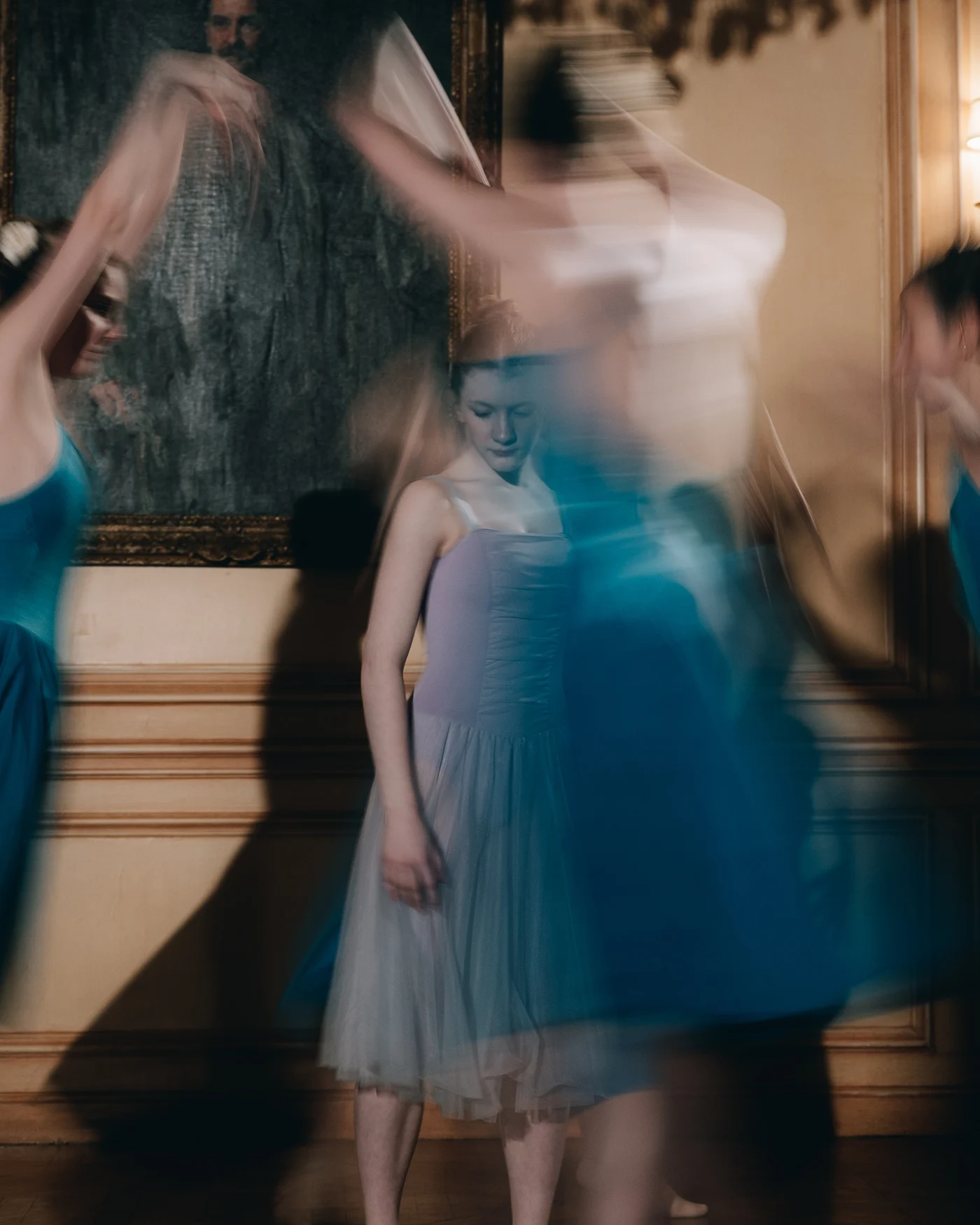 A dancer in a blue tutu, caught in motion in the second performance after dinner