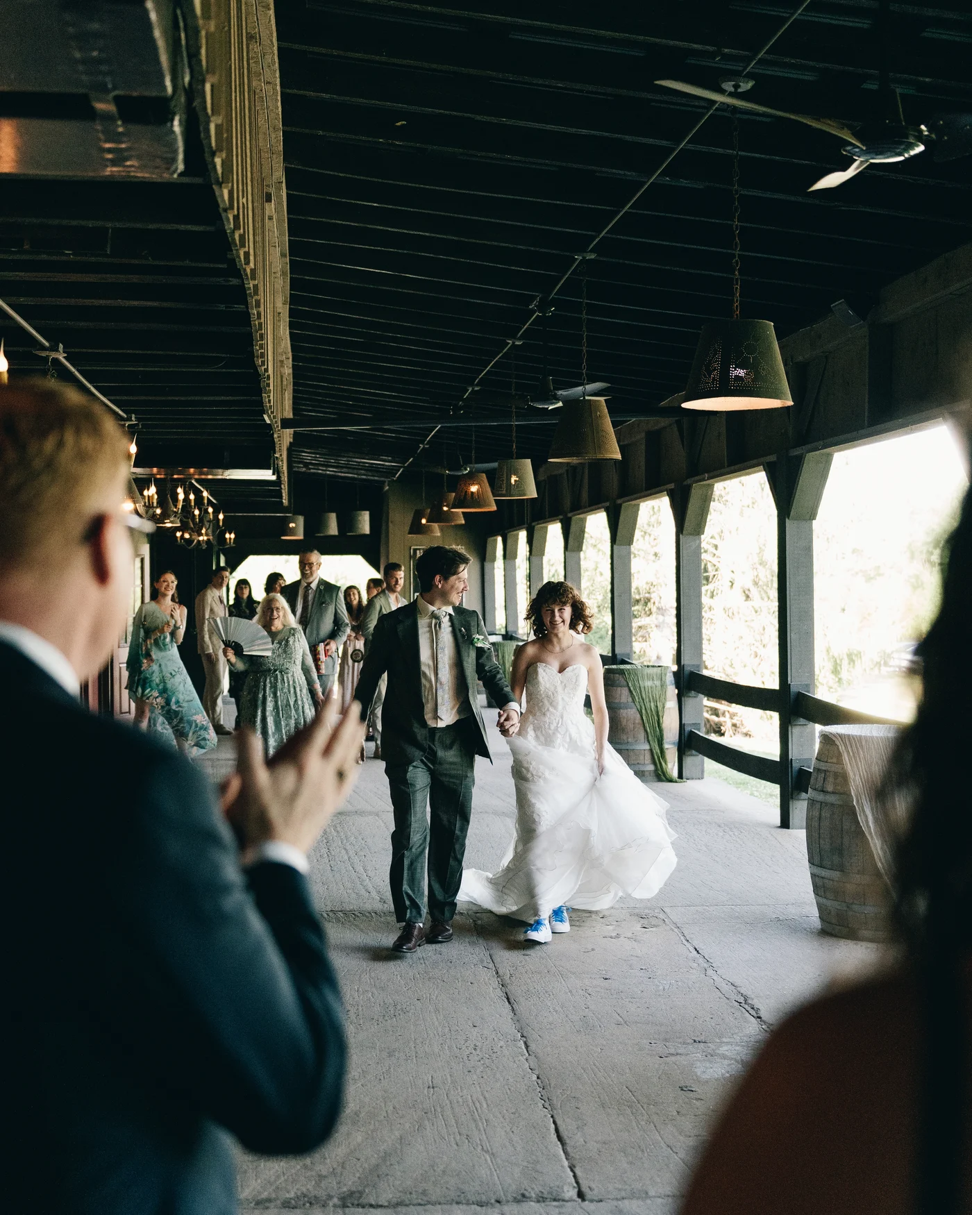 Guests gathered along the barn's long covered passage
