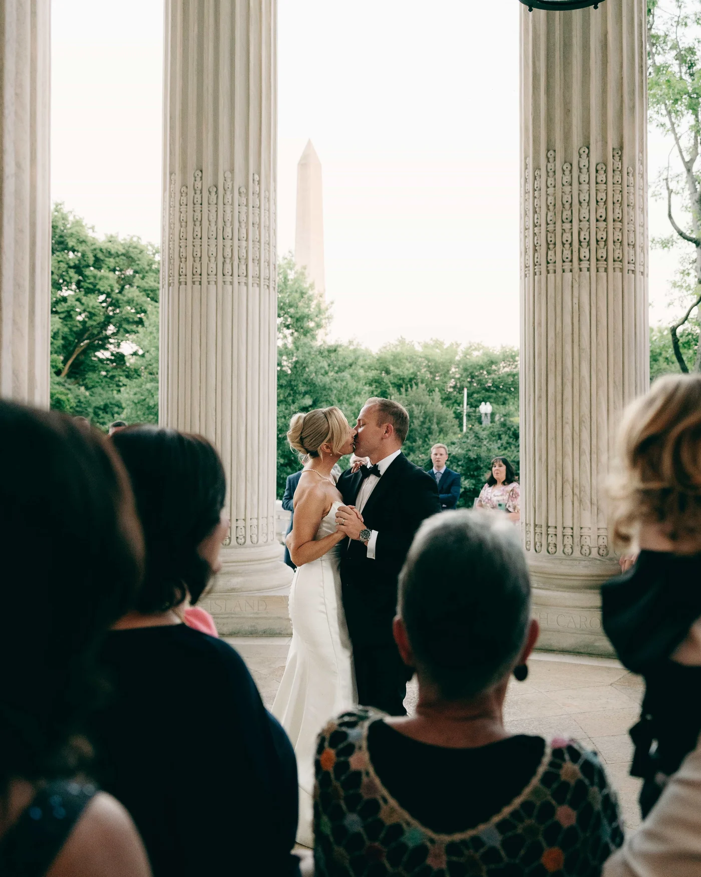 The two of them slow dancing between the columns at dusk, the Monument framed exactly in the middle